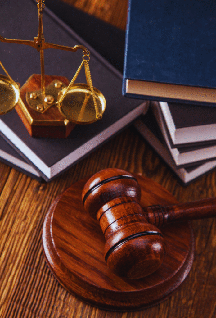 Gavel, justice scales, and legal books on the desk