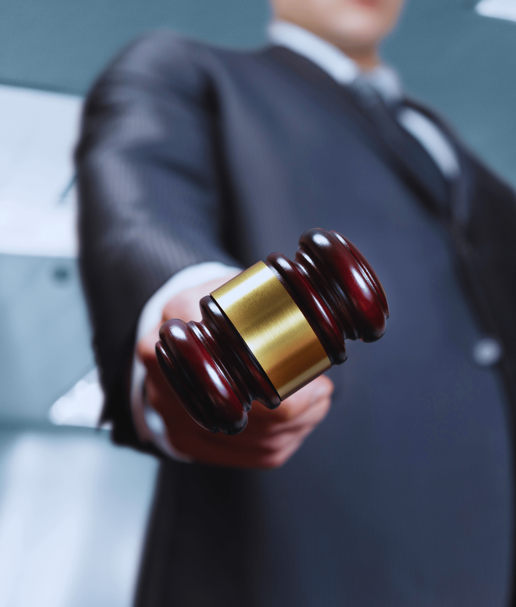 Blurred image of a lawyer holding a gavel